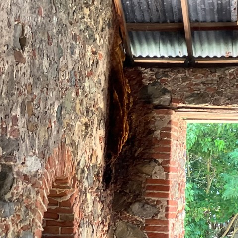 a bench in front of a brick building