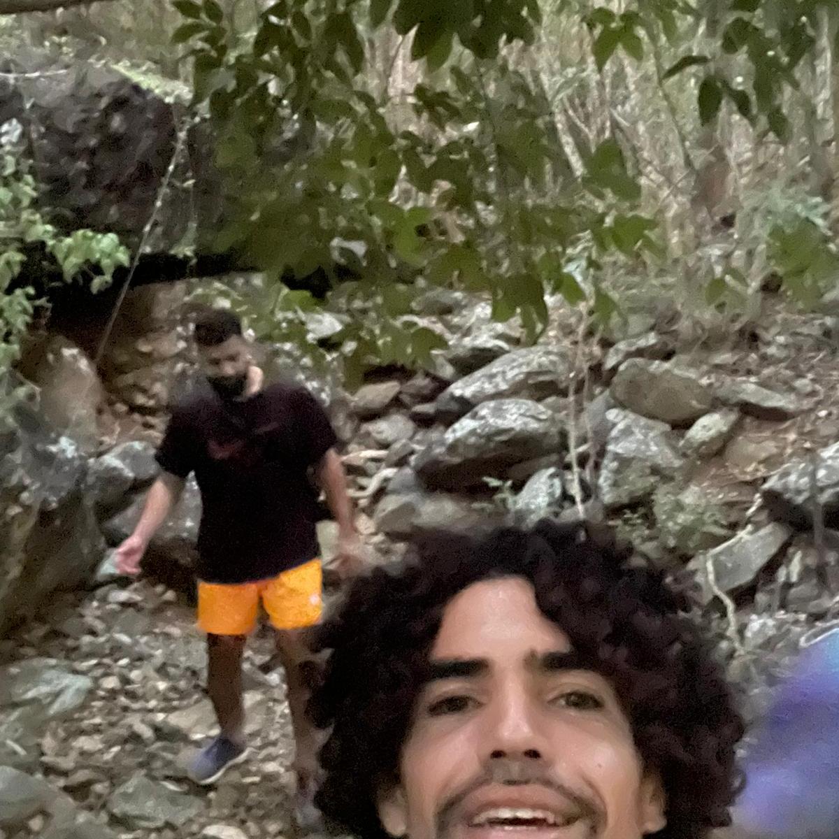 a group of people standing on a rock